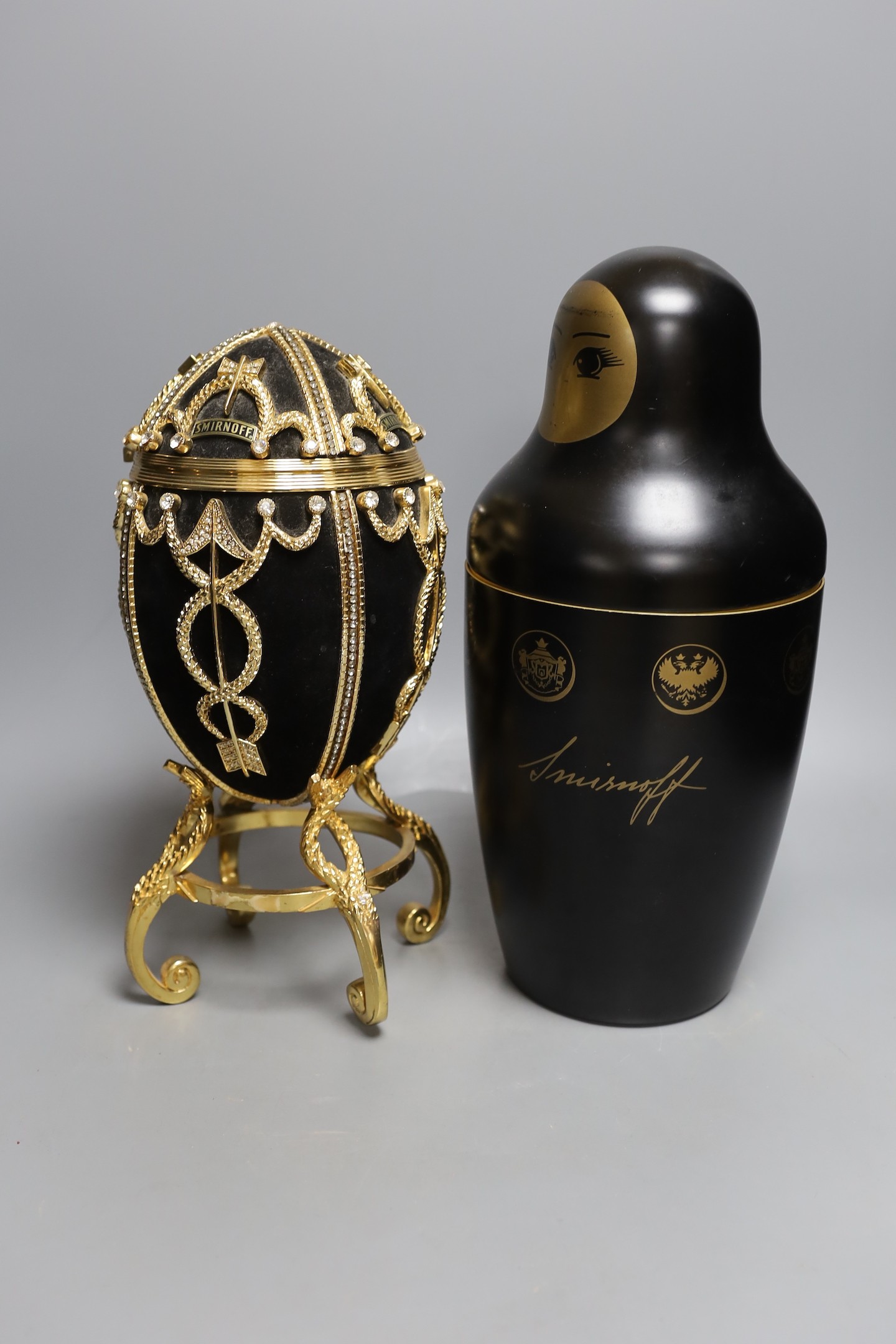 An advertising Smirnoff Russian doll metal bottle holder and an egg shaped and diamanté ice bucket, egg ice bucket 33cms high.